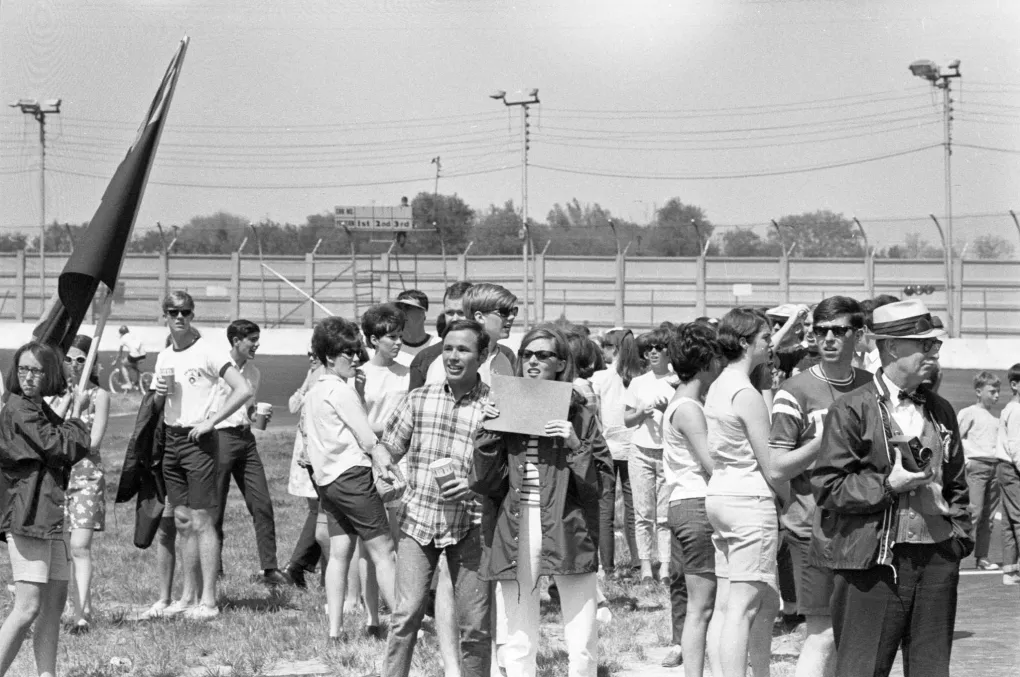 A black and white photo from 1968 of spectators at the Pegasus Pedalathon, a bicycle/tricycle racing competition among UofL’s fraternities, sororities and student groups.