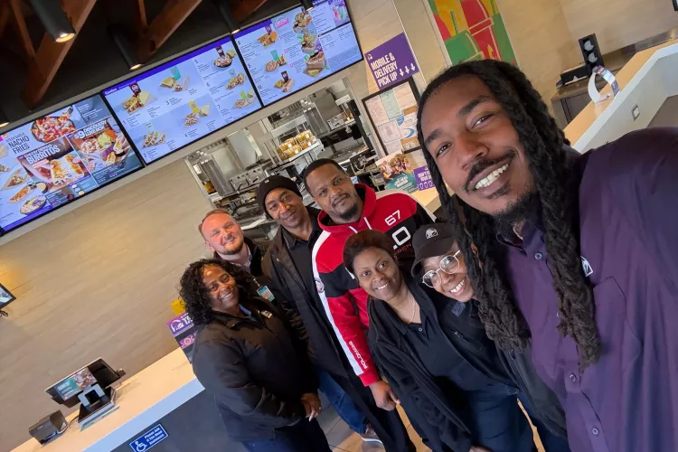 Ethan McNary and team members at a Taco Bell restaurant