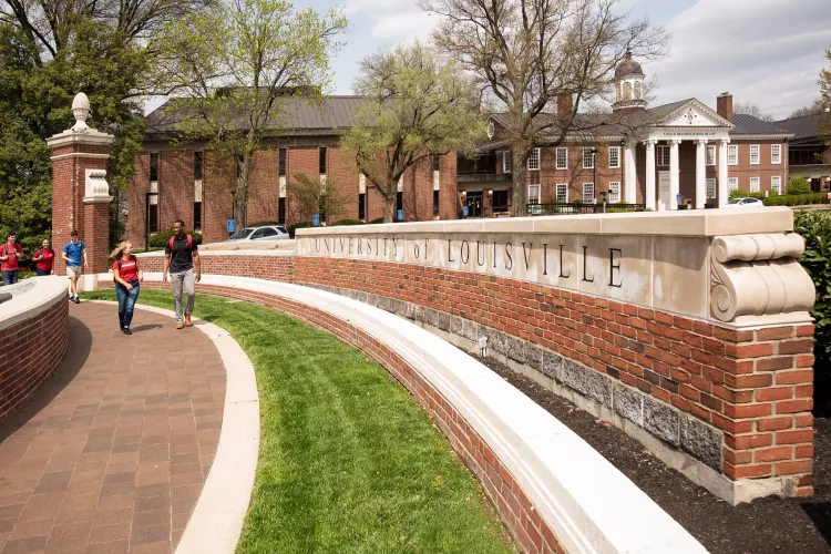 Students walking in front of Grawemeyer Hall oval
