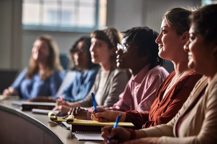 Multiple law students listen to a lecture