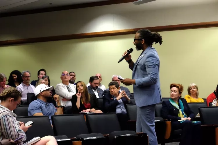 Man talking to an audience.