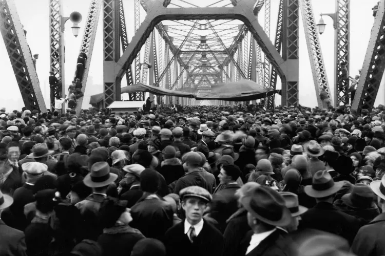 A black and white image of a large crowd gathered on the Indiana side of the Municipal Bridge in 1929.