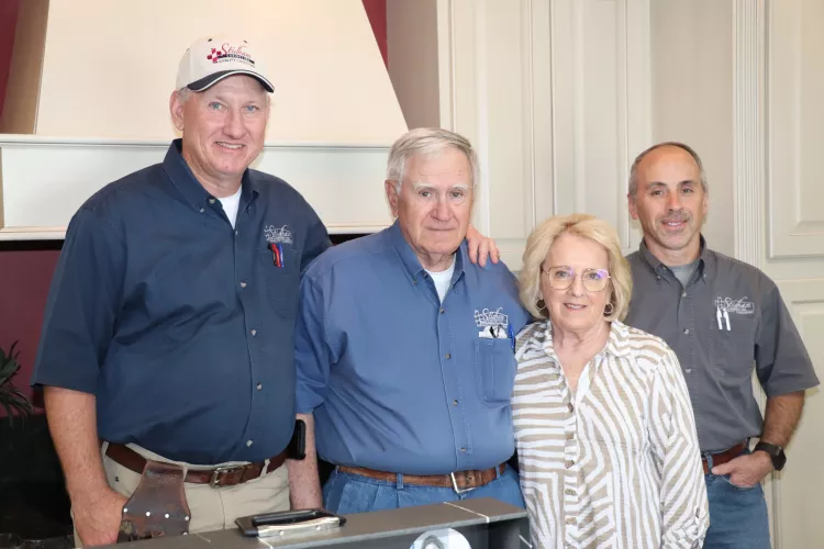 Four people standing