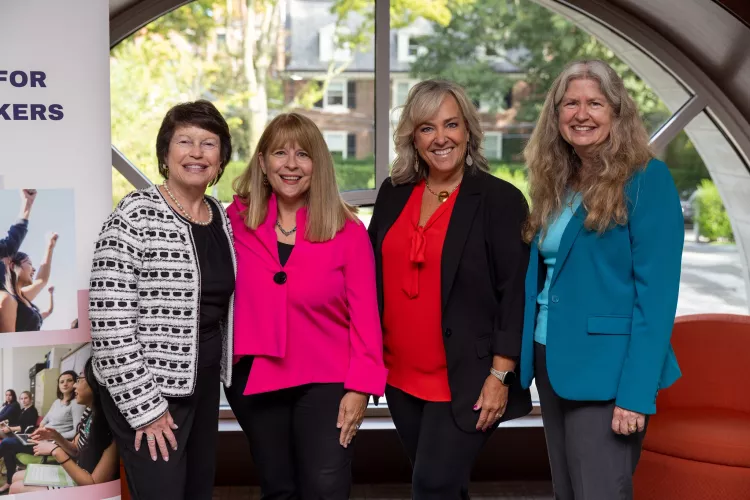 A group of four social workers at a recent oncology social worker conference at Boston University.