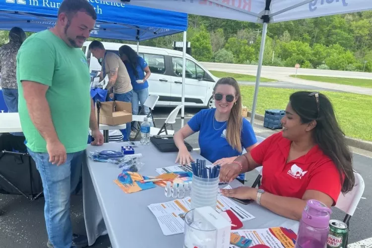 Stephie Abraham connects with residents in a Kentucky community as part of the RURAL study.