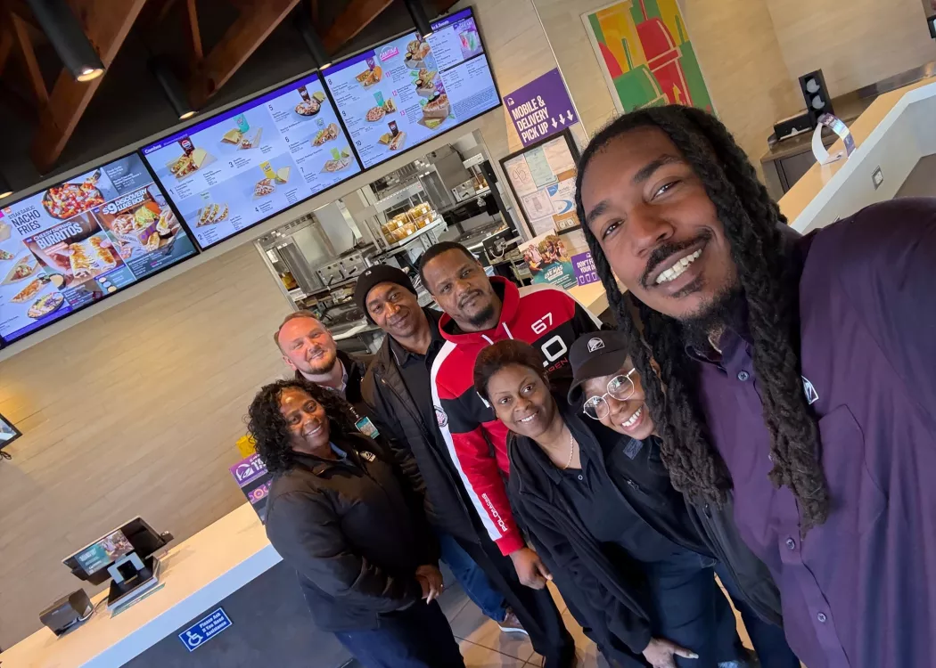 Ethan McNary and team members at a Taco Bell restaurant