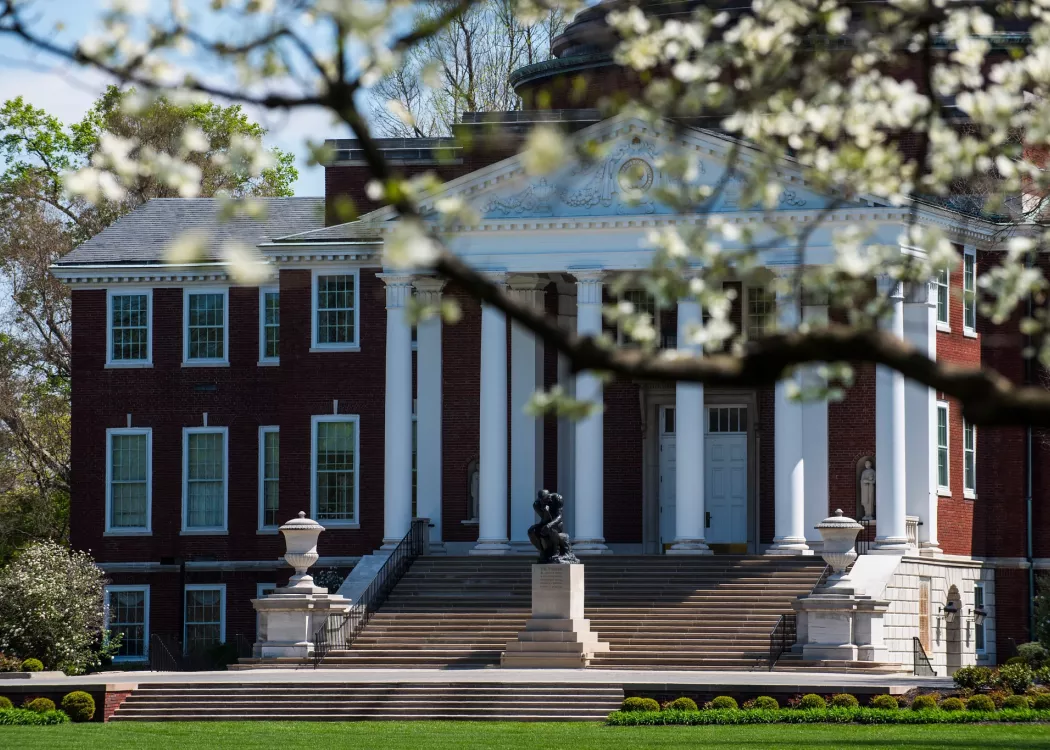 Exterior of Grawemeyer Hall with spring trees in bloom