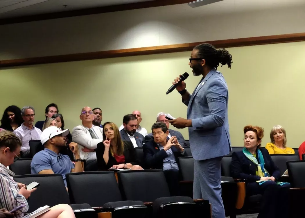 Man talking to an audience.
