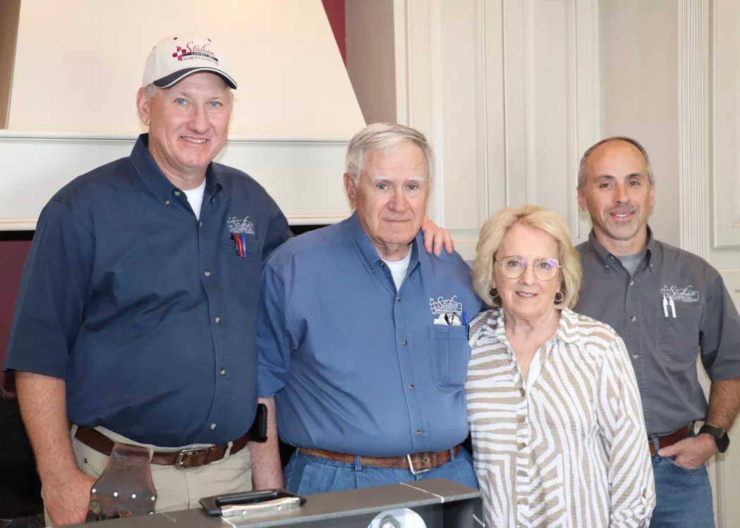Four people standing