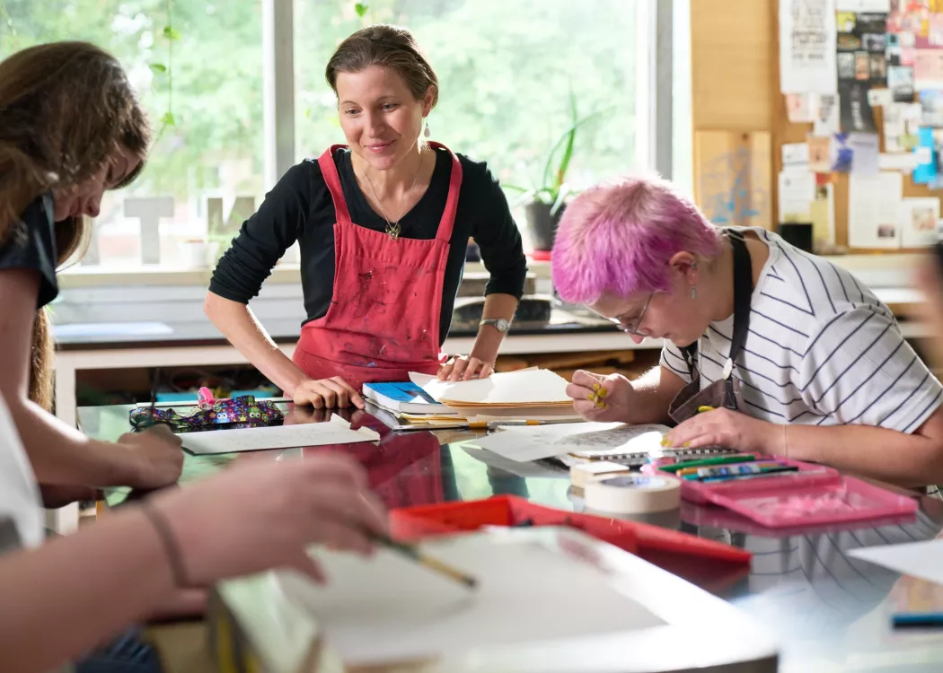 Rachel Singel, Associate Professor teaching a printmaking studio course