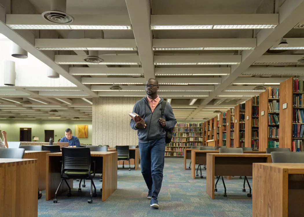 Student walks into the library.