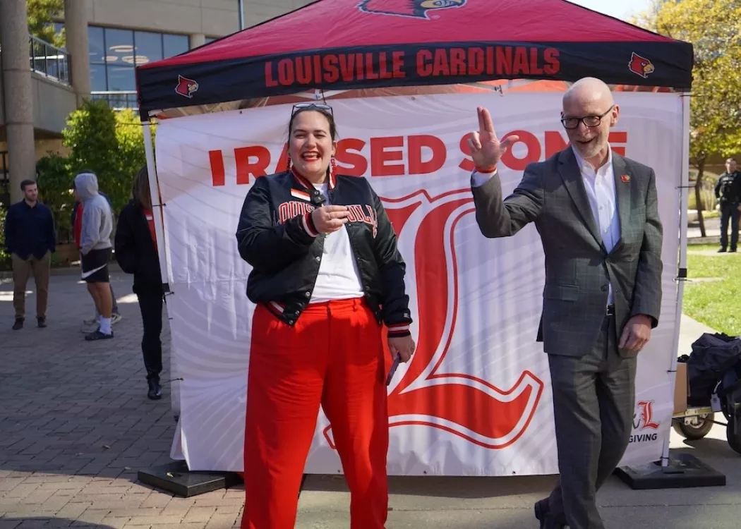 President Bradley throws an L while Amanda James laughs