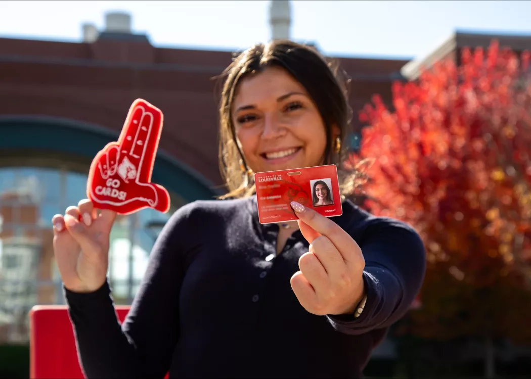 Student holding a Cardinal Card