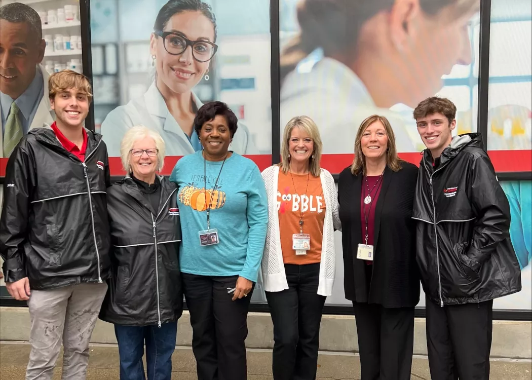 Group of staff and students in front of the UofL Ambulatory Care Building