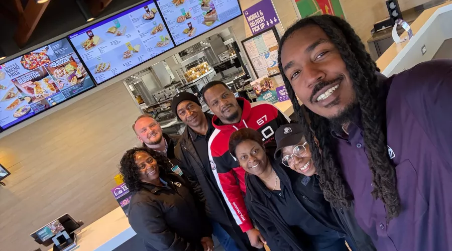 Ethan McNary and team members at a Taco Bell restaurant
