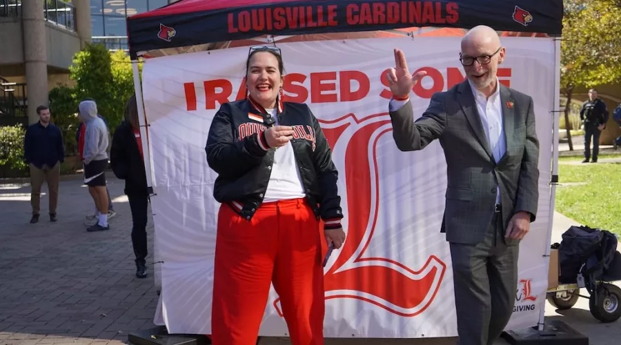 President Bradley throws an L while Amanda James laughs