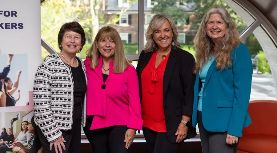 A group of four social workers at a recent oncology social worker conference at Boston University.