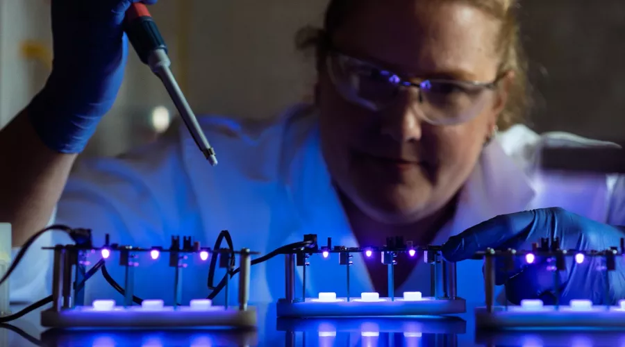 Debbie Yoder-Himes in a laboratory