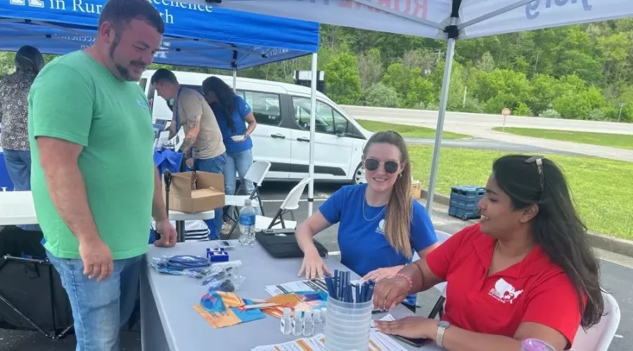 Stephie Abraham connects with residents in a Kentucky community as part of the RURAL study.