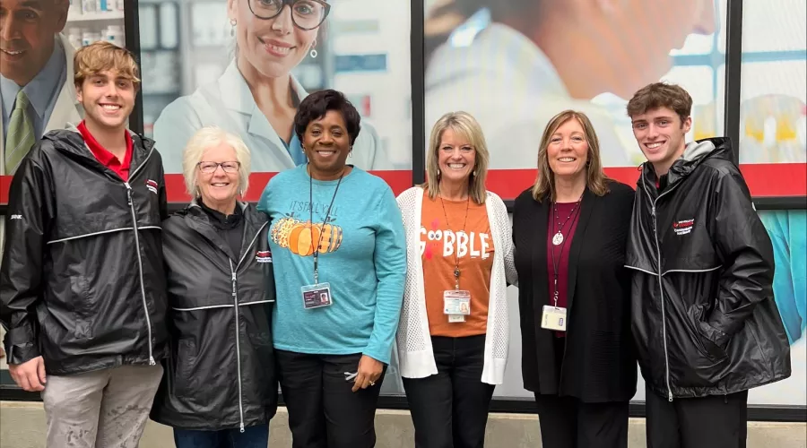 Group of staff and students in front of the UofL Ambulatory Care Building