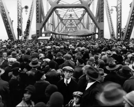 A black and white image of a large crowd gathered on the Indiana side of the Municipal Bridge in 1929.