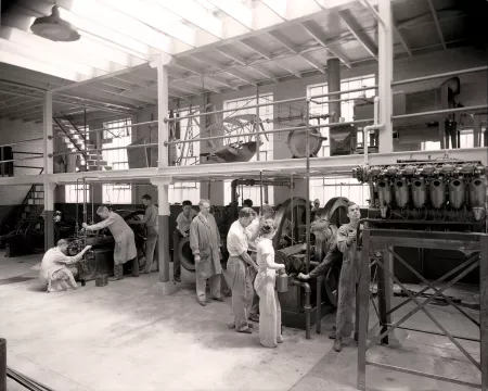 Margaret Mattingly ’37 in an engineering classroom with classmates
